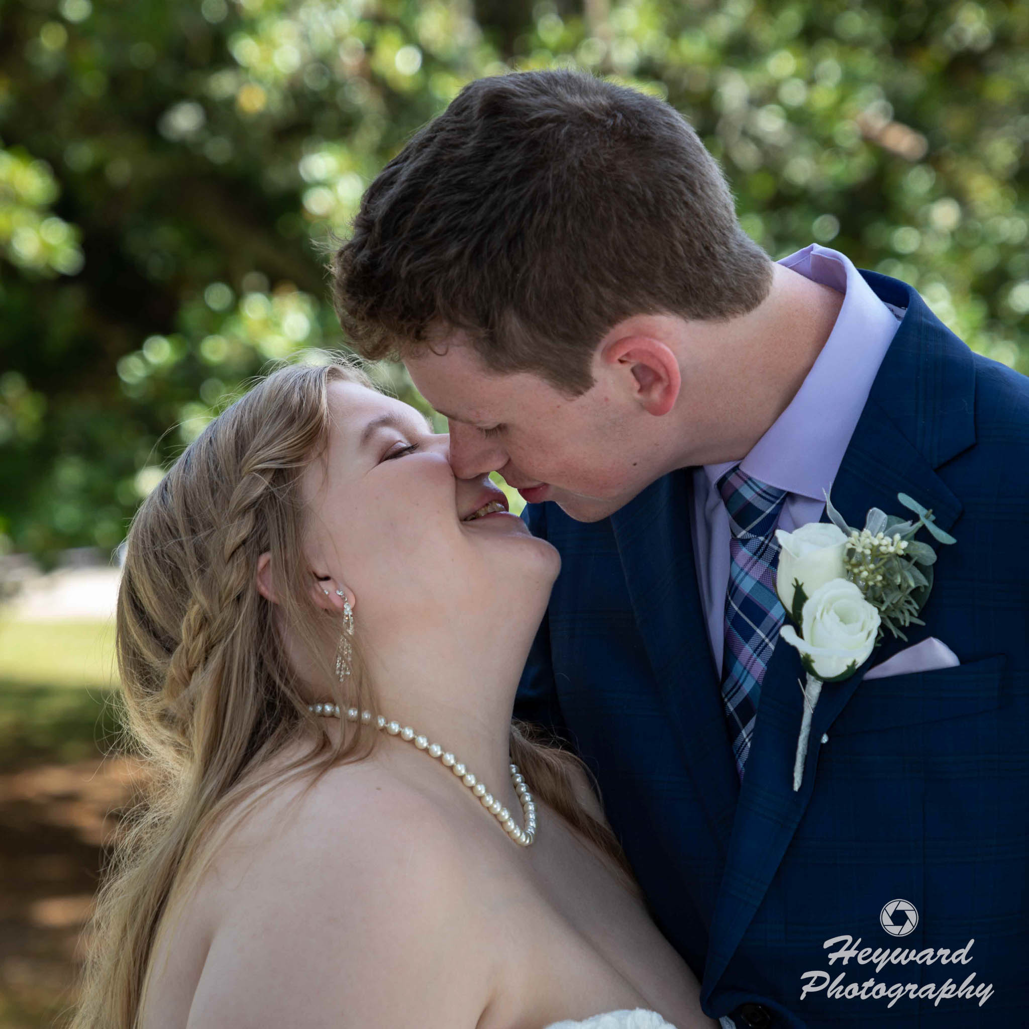 Newlyweds kissing.