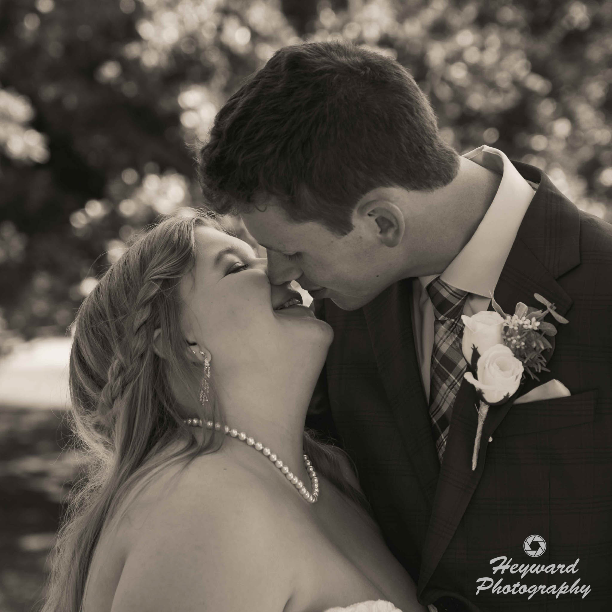 Newlyweds kissing.