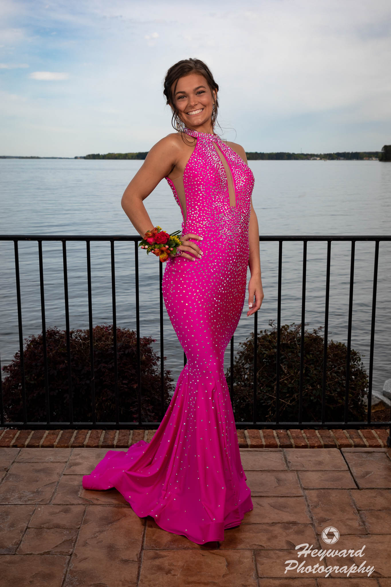 Lady in pink dress, full length.