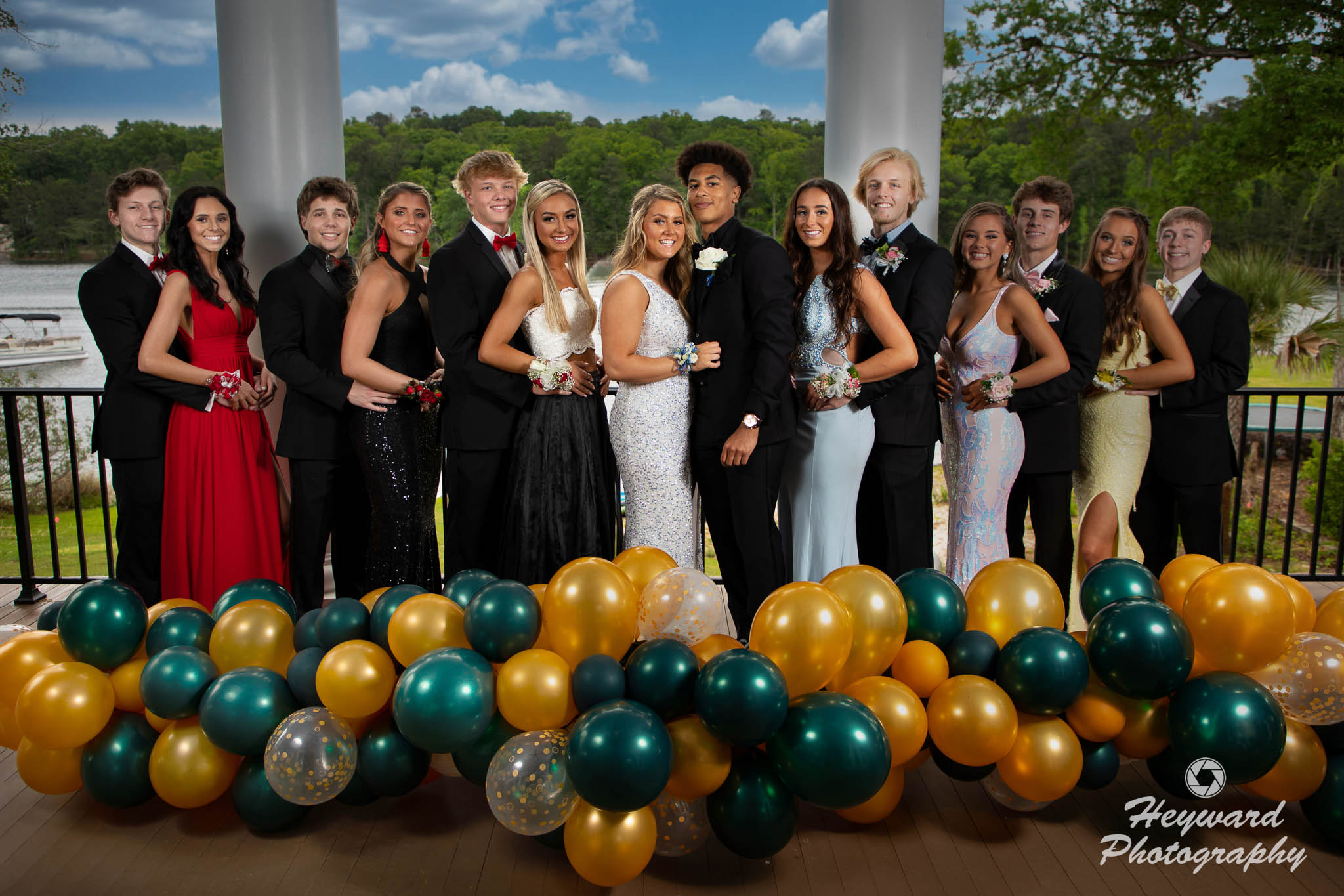 Prom couples posing for a group photo.